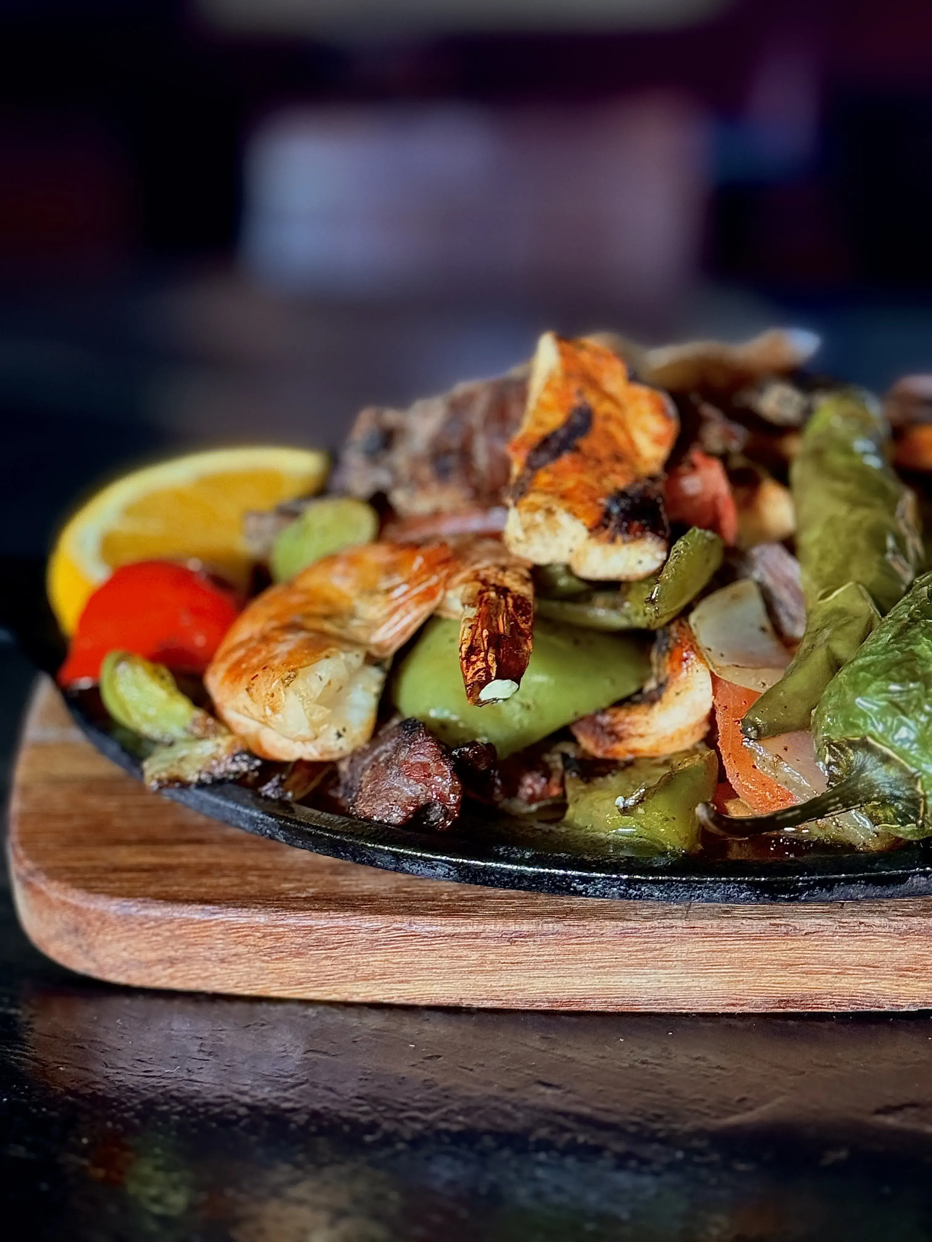 Parillada Dish that it similar to Fajitas but includes shrip and served on a sizzling and steamin castiorn palate.